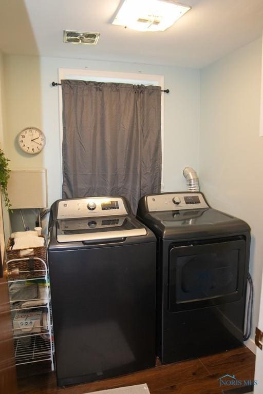 615 Hillcrest Ave, Findlay, OH 45840 - washroom featuring washing machine and clothes dryer and wood finished floors