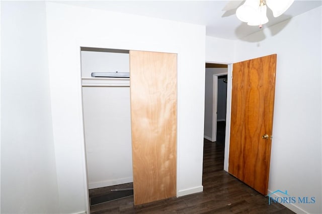 1618 S Clinton St, Defiance, OH 43512 - unfurnished bedroom with wood finished floors, a closet, ceiling fan, and baseboards