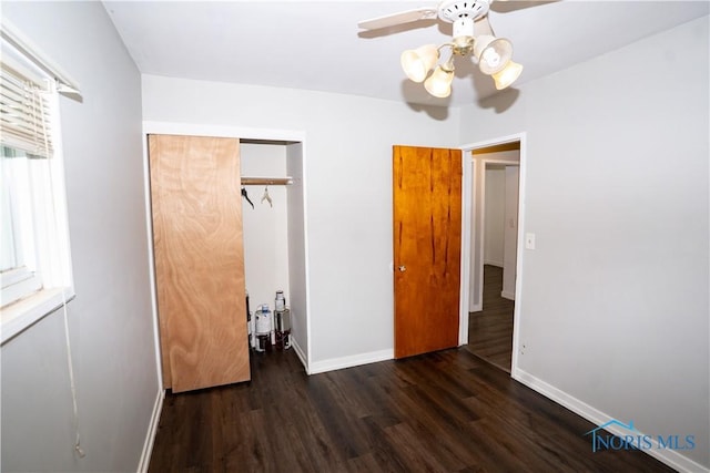1618 S Clinton St, Defiance, OH 43512 - unfurnished bedroom featuring baseboards, wood finished floors, a closet, and a ceiling fan