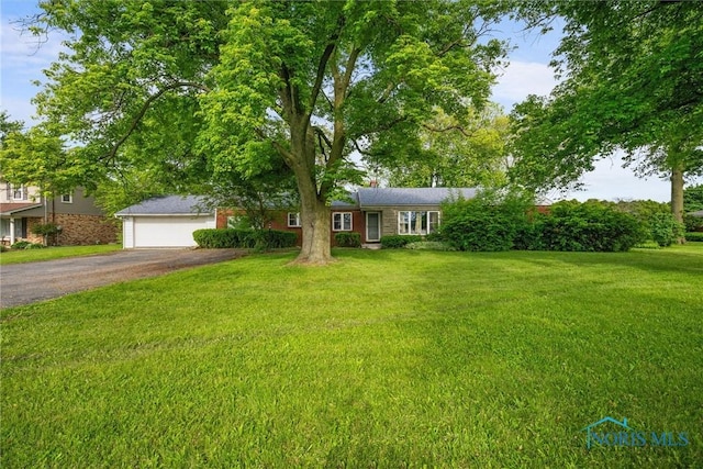 19330 N Dixie Hwy, Bowling Green, OH 43402 - ranch-style home with asphalt driveway and a front lawn