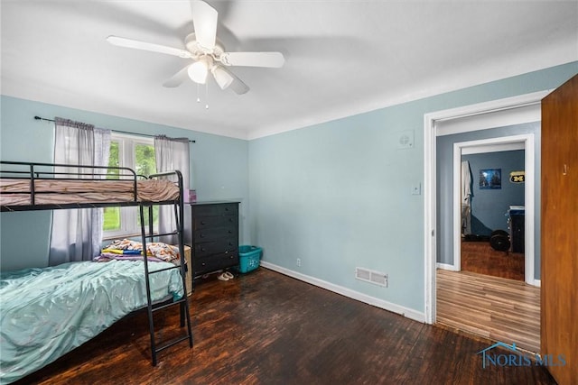 19330 N Dixie Hwy, Bowling Green, OH 43402 - bedroom with wood finished floors, baseboards, and ceiling fan