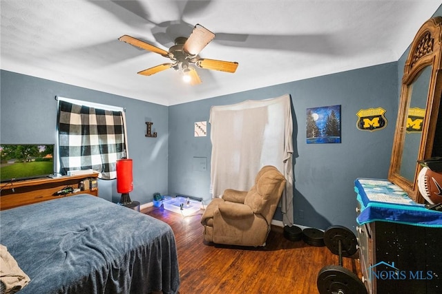 19330 N Dixie Hwy, Bowling Green, OH 43402 - bedroom featuring wood finished floors, a ceiling fan, and baseboards