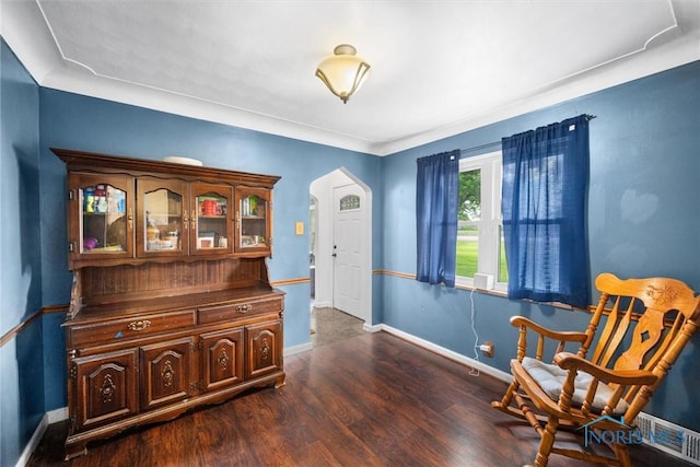 19330 N Dixie Hwy, Bowling Green, OH 43402 - living area with arched walkways, dark wood-type flooring, and baseboards