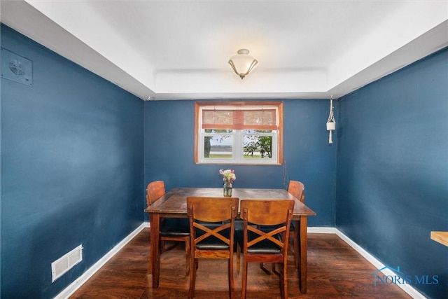 19330 N Dixie Hwy, Bowling Green, OH 43402 - dining room with baseboards, wood finished floors, and a tray ceiling