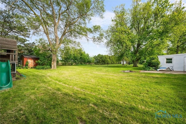 19330 N Dixie Hwy, Bowling Green, OH 43402 - view of grassy yard with a playground