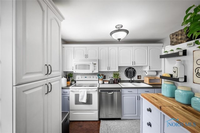 5453 Brook Point Rd, Toledo, OH 43611 - kitchen with white appliances, a sink, butcher block countertops, and white cabinetry