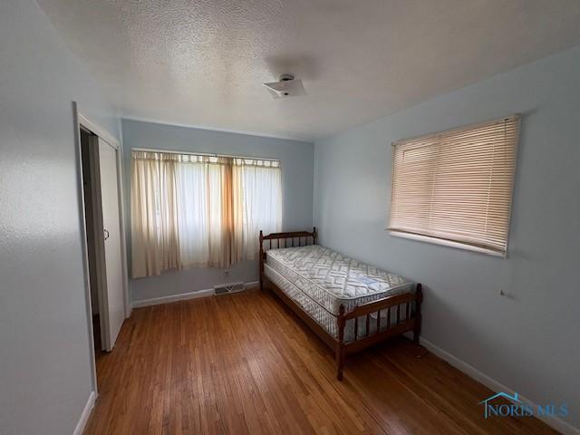 23695 E Second St, Grand Rapids, OH 43522 - bedroom featuring wood finished floors and baseboards