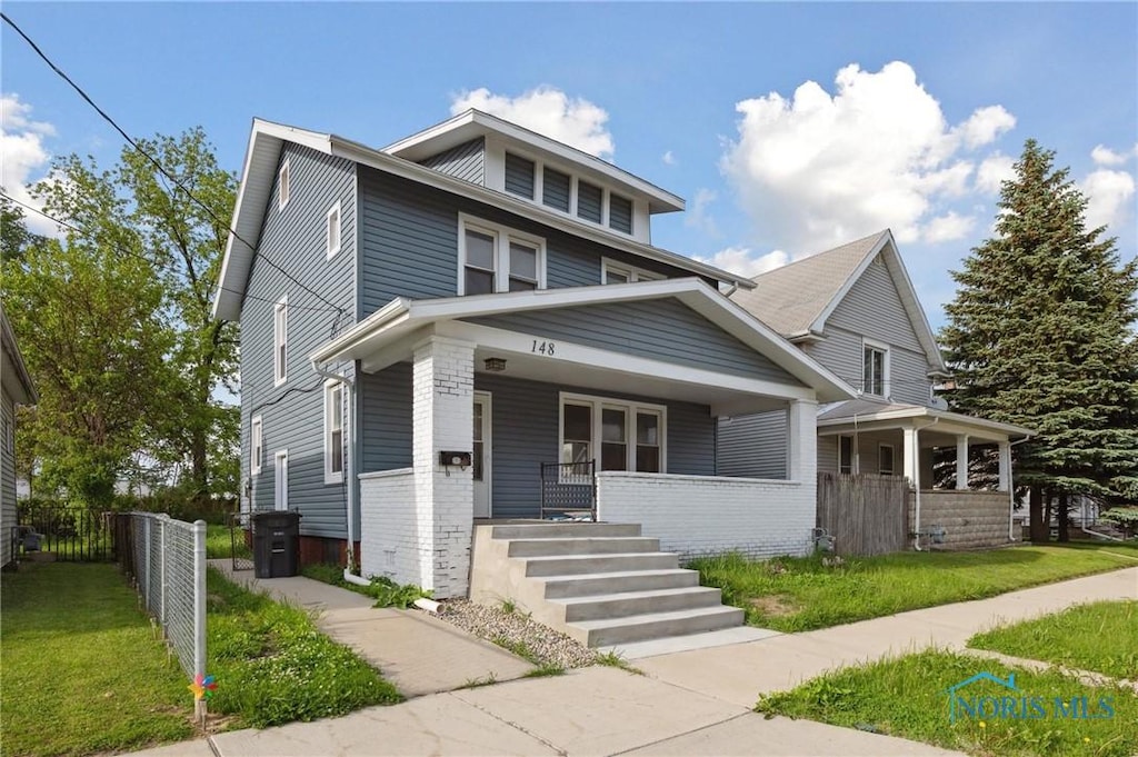 148 W Foulkes St, Toledo, OH 43605 - american foursquare style home with covered porch and brick siding