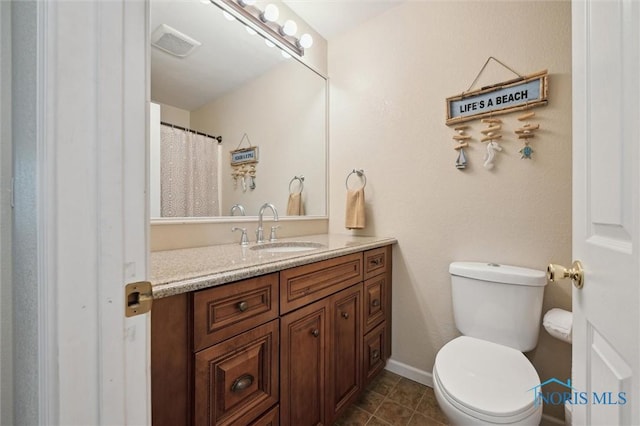 3480 Circle Dr, Delta, OH 43515 - bathroom with vanity, toilet, tile patterned flooring, and baseboards