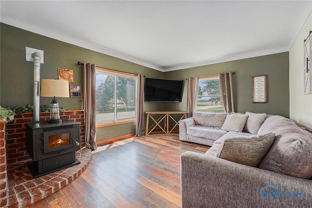 22227 US Highway 20a, West Unity, OH 43570 - living room with a wood stove and wood finished floors