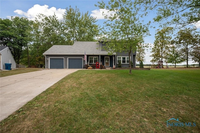 219 Illinois Dr, Bryan, OH 43506 - view of front of home featuring an attached garage, a front yard, and concrete driveway
