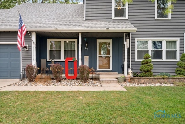 219 Illinois Dr, Bryan, OH 43506 - property entrance with a shingled roof, a lawn, a garage, a porch, and board and batten siding