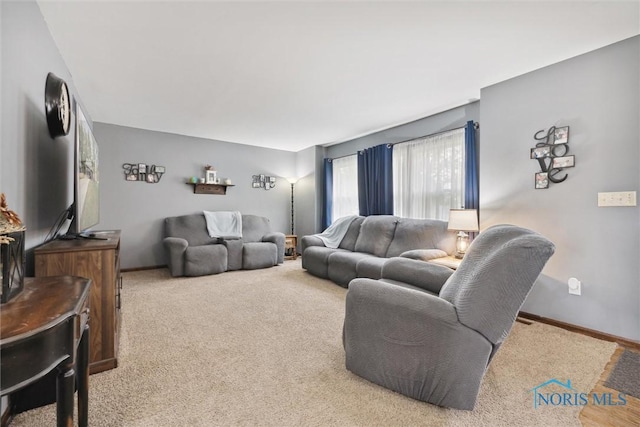 219 Illinois Dr, Bryan, OH 43506 - carpeted living room featuring baseboards