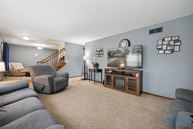 219 Illinois Dr, Bryan, OH 43506 - living room with stairway, carpet flooring, and baseboards
