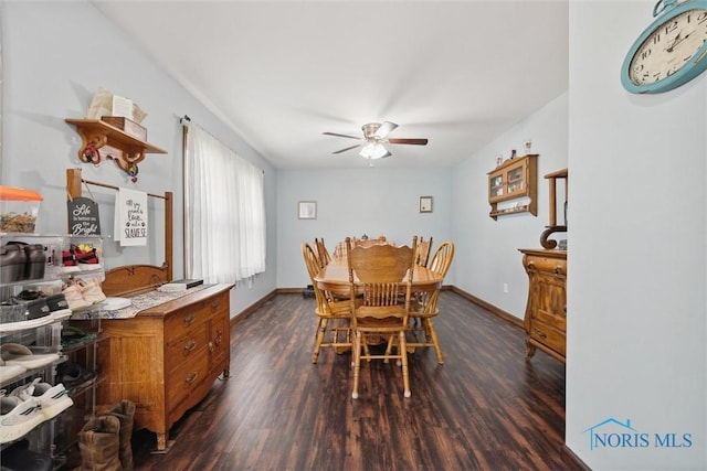 219 Illinois Dr, Bryan, OH 43506 - dining room featuring dark wood-style flooring, a ceiling fan, and baseboards