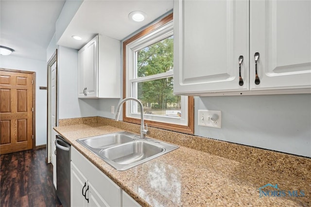219 Illinois Dr, Bryan, OH 43506 - kitchen featuring a sink, white cabinetry, light countertops, dishwasher, and dark wood finished floors
