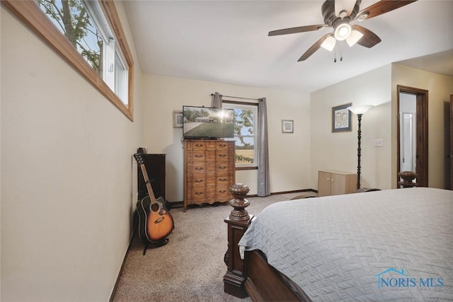 219 Illinois Dr, Bryan, OH 43506 - bedroom featuring carpet floors, baseboards, and a ceiling fan