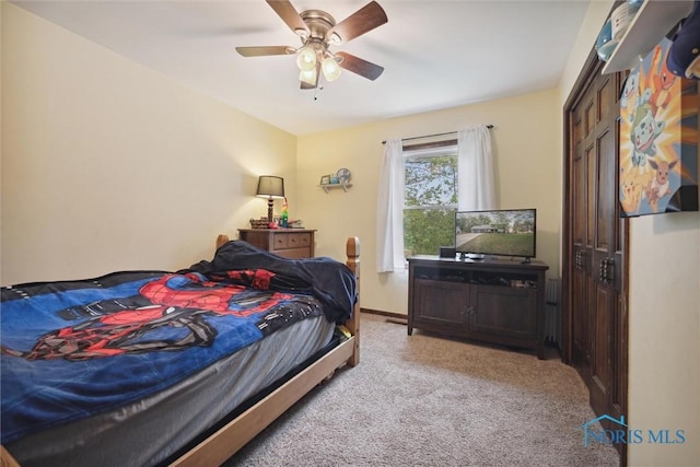 219 Illinois Dr, Bryan, OH 43506 - bedroom with light carpet, a ceiling fan, and baseboards