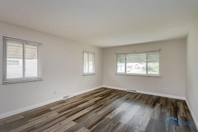 1048 Richland St, Maumee, OH 43537 - unfurnished room featuring dark wood finished floors and baseboards