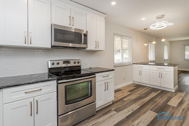 1048 Richland St, Maumee, OH 43537 - kitchen featuring stainless steel appliances, healthy amount of natural light, white cabinets, baseboards, and recessed lighting
