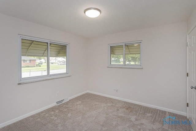 1048 Richland St, Maumee, OH 43537 - empty room with carpet flooring and baseboards