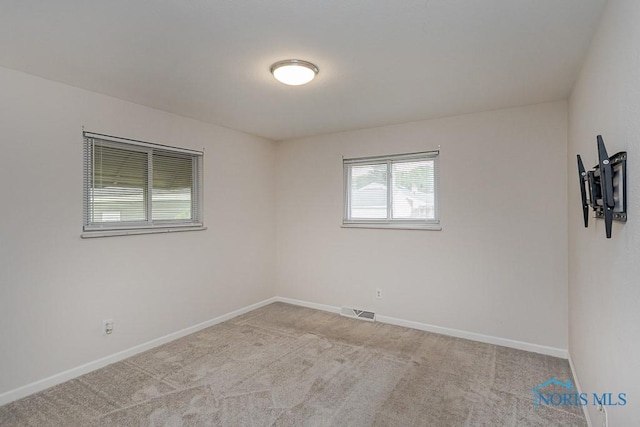 1048 Richland St, Maumee, OH 43537 - spare room featuring carpet floors and baseboards