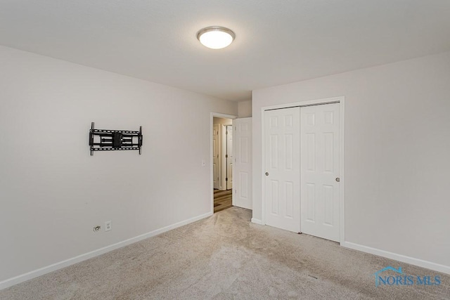 1048 Richland St, Maumee, OH 43537 - unfurnished bedroom with baseboards, carpet floors, and a closet