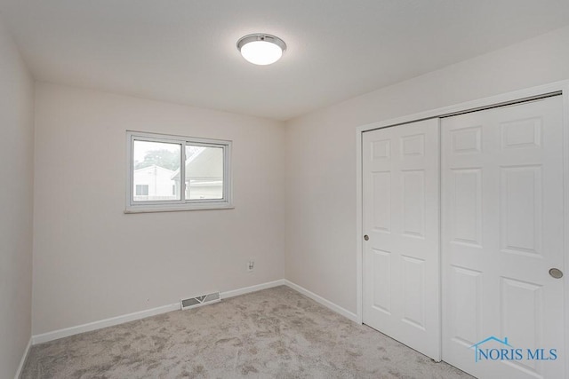 1048 Richland St, Maumee, OH 43537 - unfurnished bedroom with baseboards, carpet, and a closet