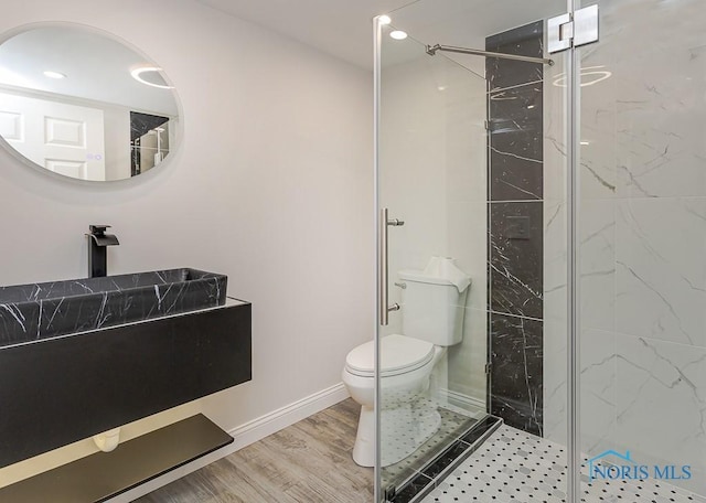 1048 Richland St, Maumee, OH 43537 - bathroom featuring toilet, a marble finish shower, wood finished floors, vanity, and recessed lighting