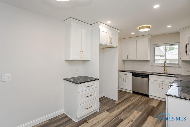 1048 Richland St, Maumee, OH 43537 - kitchen with dishwasher, a sink, decorative backsplash, dark wood-style flooring, and white cabinets