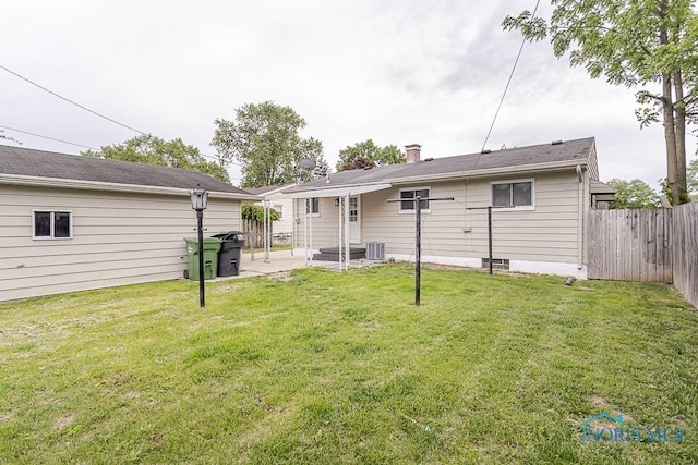 1048 Richland St, Maumee, OH 43537 - rear view of property featuring a patio, cooling unit, and a chimney