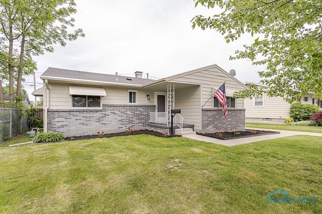 1048 Richland St, Maumee, OH 43537 - view of front facade with brick siding and a chimney