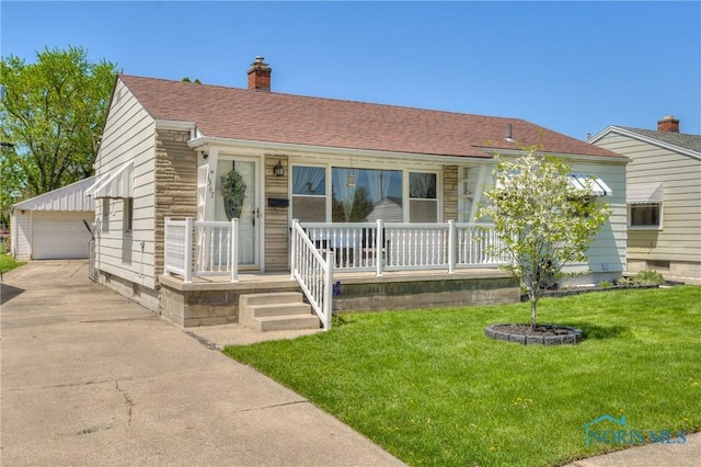1367 Junior Dr, Maumee, OH 43537 - view of front facade featuring covered porch, a chimney, an outdoor structure, a front lawn, and a detached garage