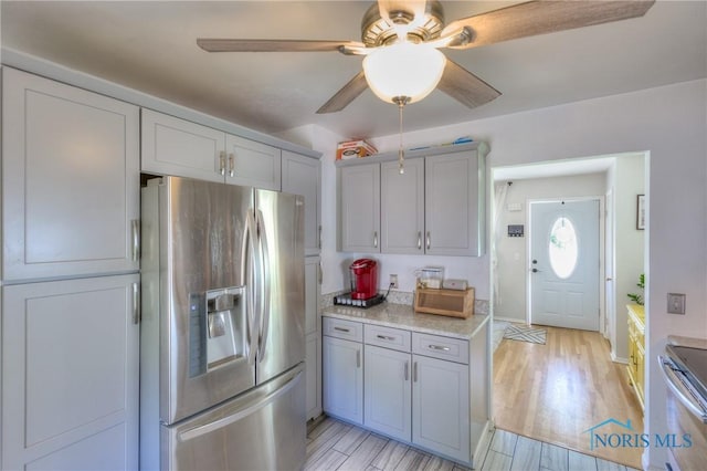 1367 Junior Dr, Maumee, OH 43537 - kitchen with stainless steel appliances, ceiling fan, light wood-type flooring, and gray cabinets