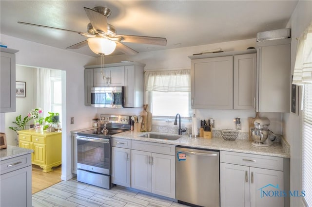 1367 Junior Dr, Maumee, OH 43537 - kitchen with appliances with stainless steel finishes, a sink, and gray cabinets
