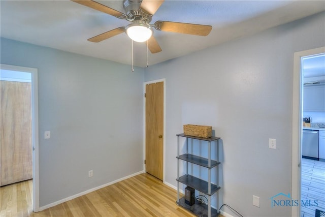 1367 Junior Dr, Maumee, OH 43537 - unfurnished bedroom with light wood-style flooring, baseboards, and ceiling fan