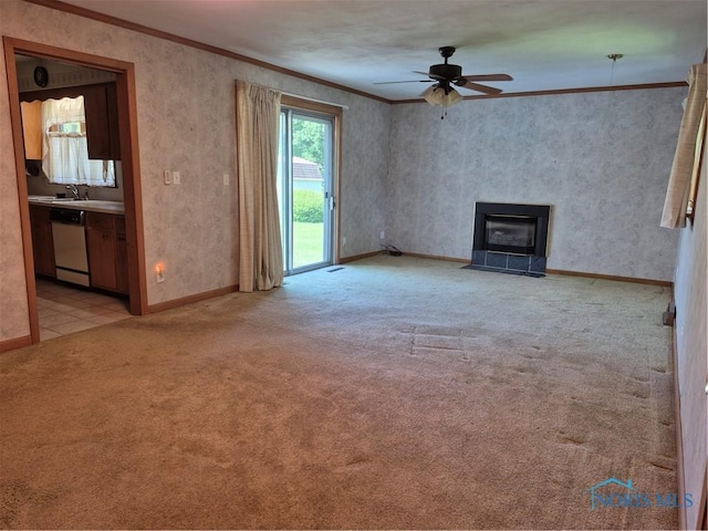1100 Cherry Ln, Findlay, OH 45840 - unfurnished living room featuring crown molding, light carpet, a ceiling fan, baseboards, and a fireplace with flush hearth