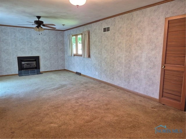 1100 Cherry Ln, Findlay, OH 45840 - unfurnished living room featuring a ceiling fan, crown molding, carpet flooring, a fireplace, and baseboards