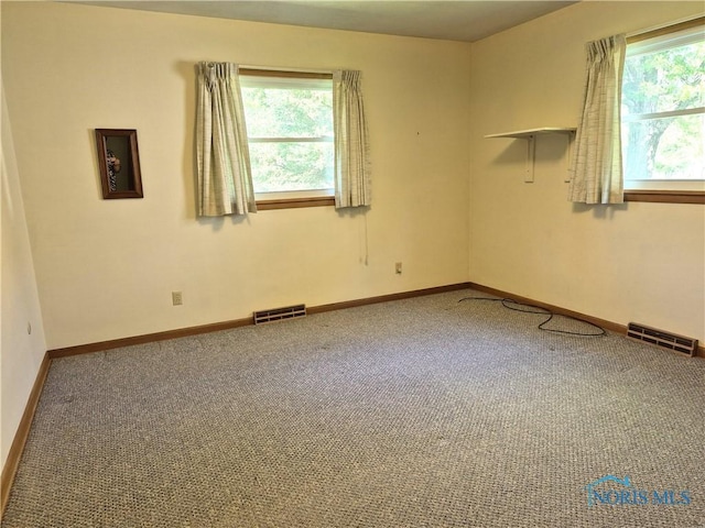 1100 Cherry Ln, Findlay, OH 45840 - carpeted empty room with plenty of natural light and baseboards