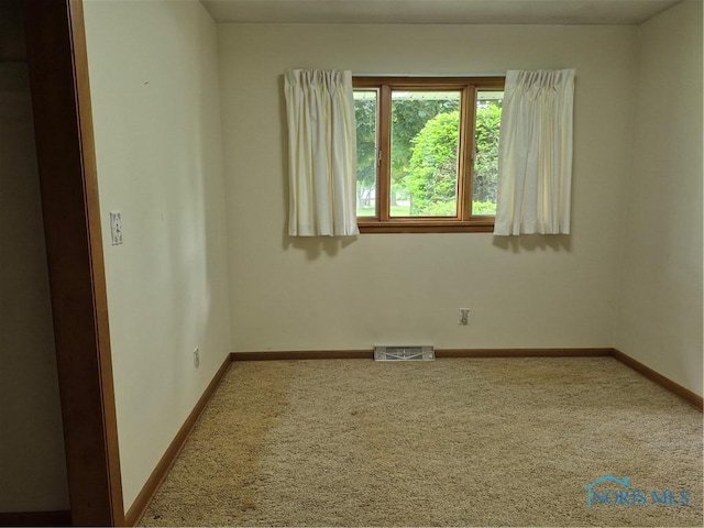 1100 Cherry Ln, Findlay, OH 45840 - empty room with carpet flooring and baseboards