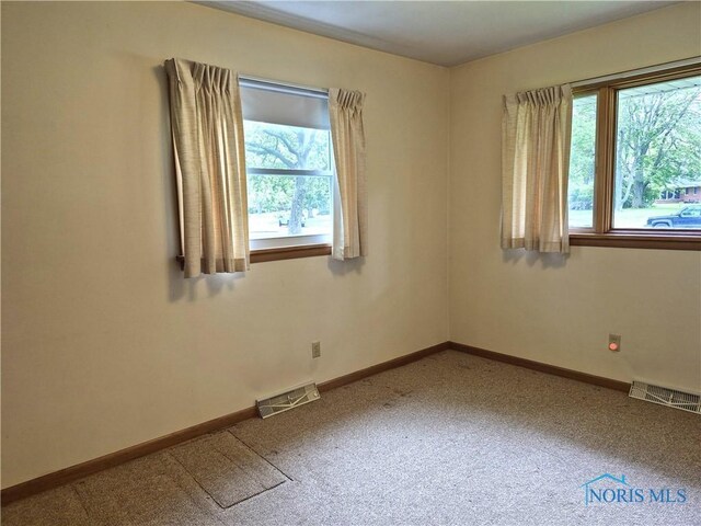 1100 Cherry Ln, Findlay, OH 45840 - carpeted empty room featuring baseboards