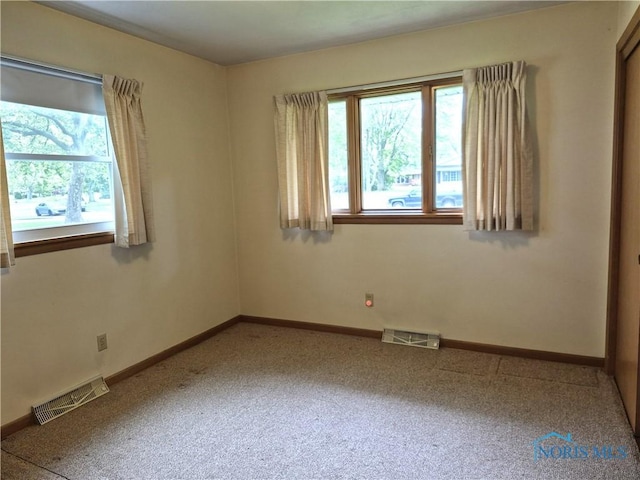 1100 Cherry Ln, Findlay, OH 45840 - carpeted empty room featuring healthy amount of natural light and baseboards