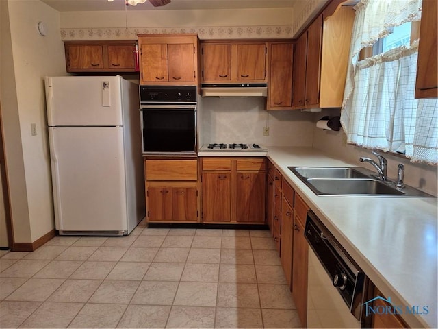 1100 Cherry Ln, Findlay, OH 45840 - kitchen with oven, freestanding refrigerator, dishwasher, under cabinet range hood, and a sink
