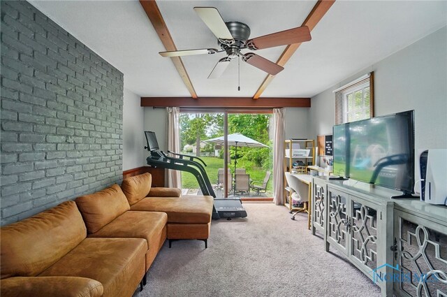 314 E 2nd St, Perrysburg, OH 43551 - living area featuring beam ceiling, healthy amount of natural light, carpet floors, a ceiling fan, and brick wall