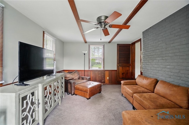 314 E 2nd St, Perrysburg, OH 43551 - living room with plenty of natural light, a wainscoted wall, ceiling fan, carpet floors, and wooden walls