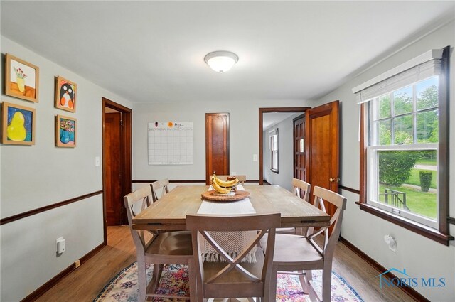 314 E 2nd St, Perrysburg, OH 43551 - dining area with wood finished floors and baseboards