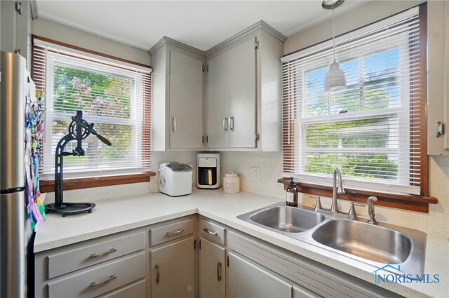 314 E 2nd St, Perrysburg, OH 43551 - kitchen featuring gray cabinetry, a sink, plenty of natural light, and freestanding refrigerator