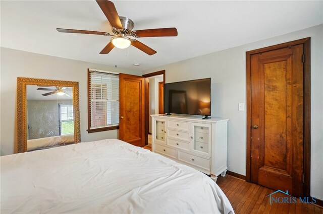 314 E 2nd St, Perrysburg, OH 43551 - bedroom with hardwood / wood-style floors, baseboards, and a ceiling fan
