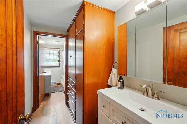 314 E 2nd St, Perrysburg, OH 43551 - bathroom featuring vanity and wood finished floors
