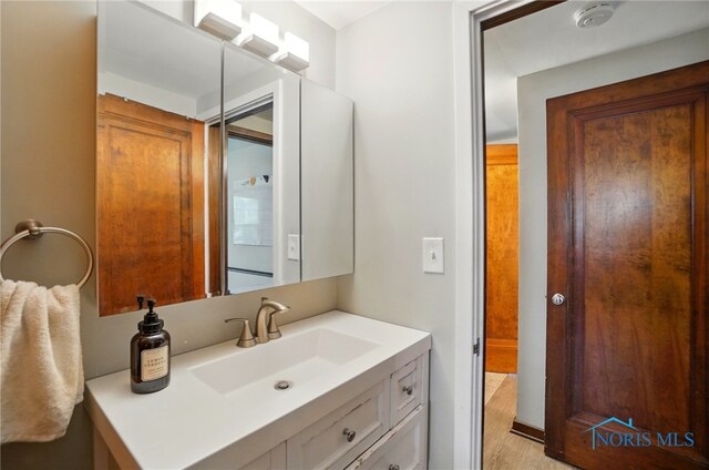 314 E 2nd St, Perrysburg, OH 43551 - bathroom with vanity and wood finished floors